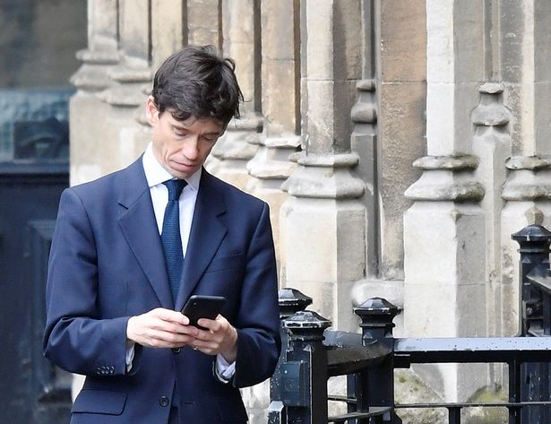 0_Britains-Secretary-of-State-for-International-Development-Rory-Stewart-checks-his-phone-outside-Hou.jpg