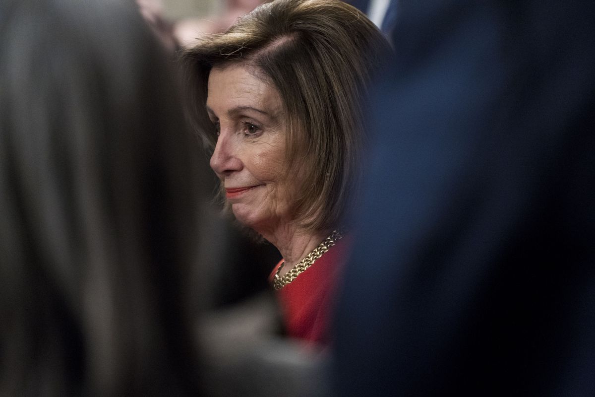 House Speaker Nancy Pelosi, (D-CA) listens during a press conference with House Democrats Thursday